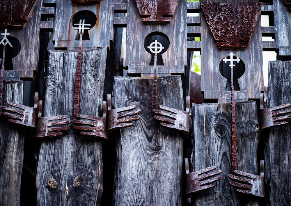 a group of wooden structures with crosses on them