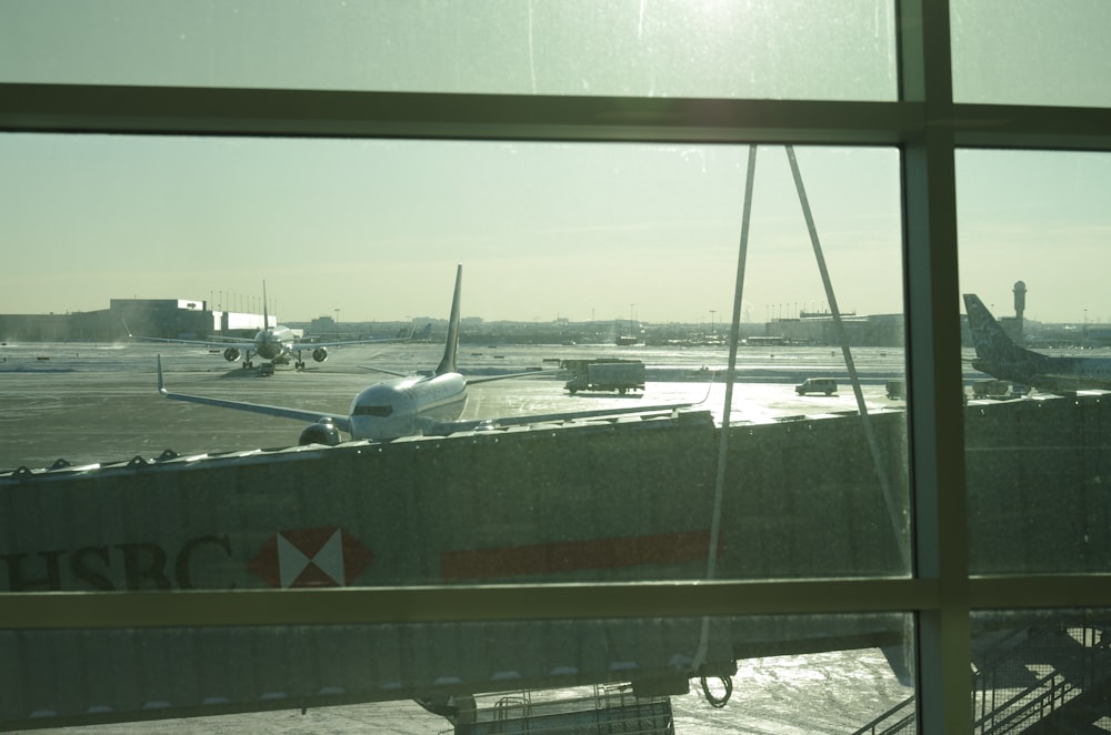 white airliner on green field during daytime