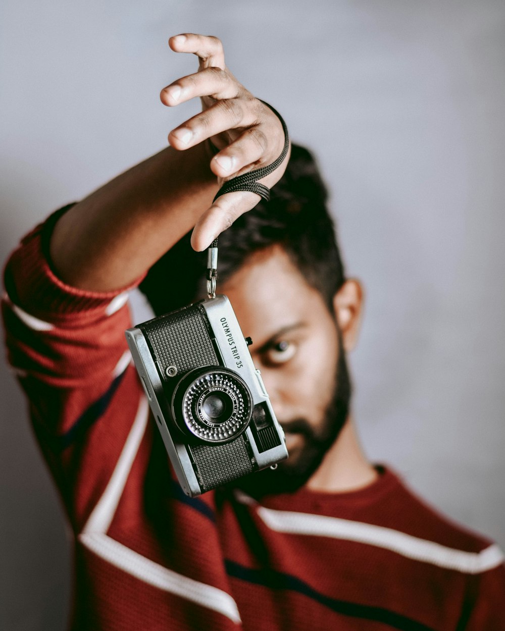 unknown celebrity holding black and gray camera