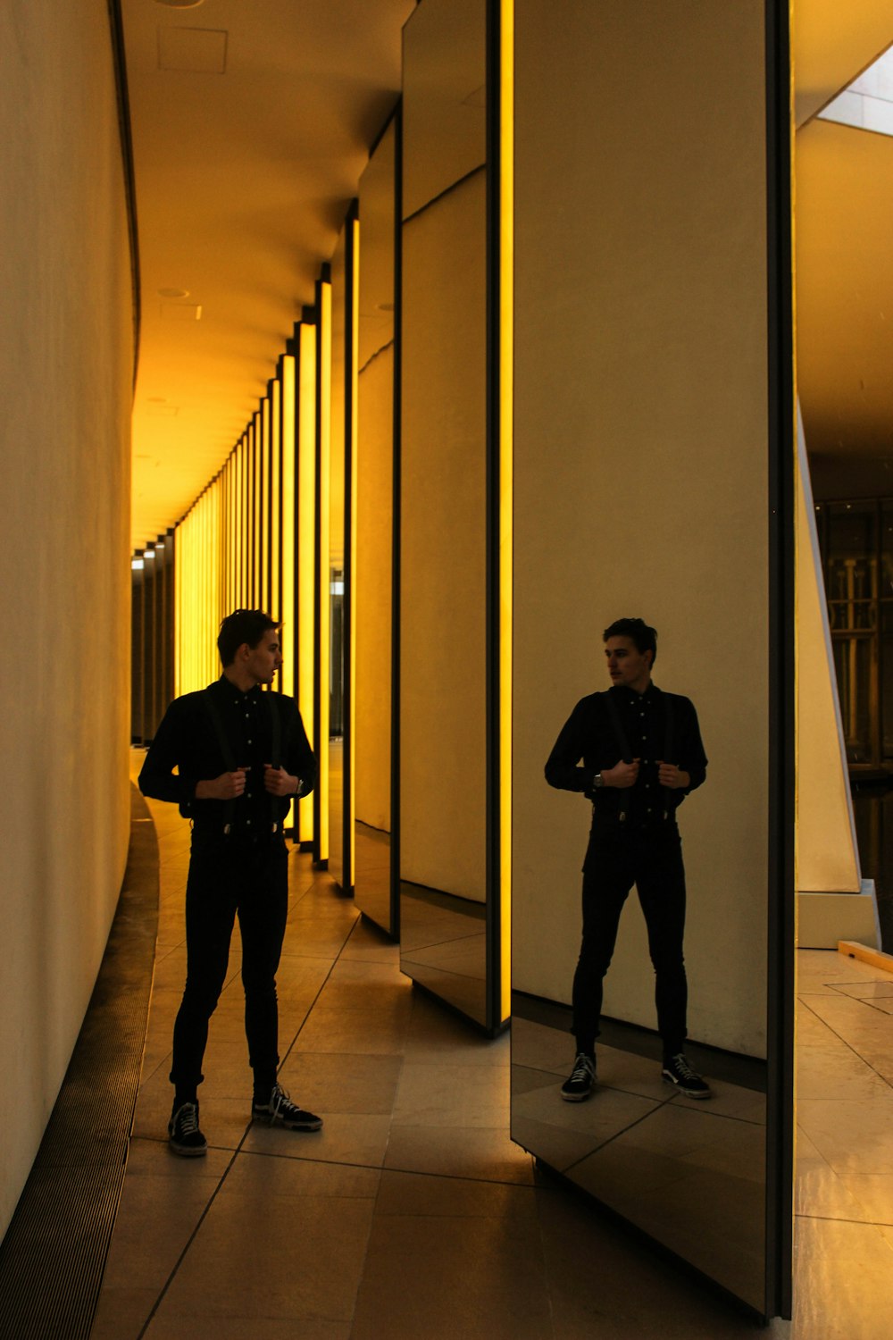 man standing in front of mirror