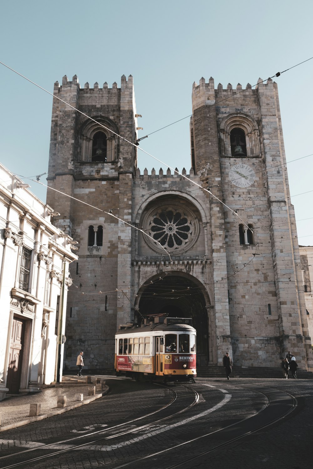 white red Tram near the building