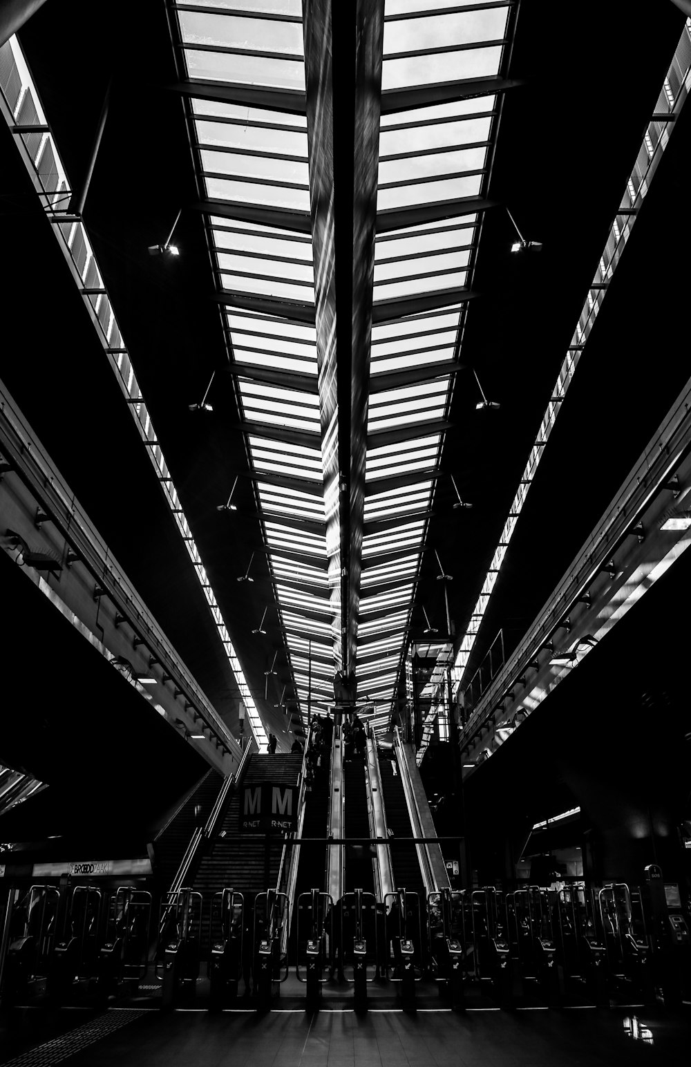 a black and white photo of a train station