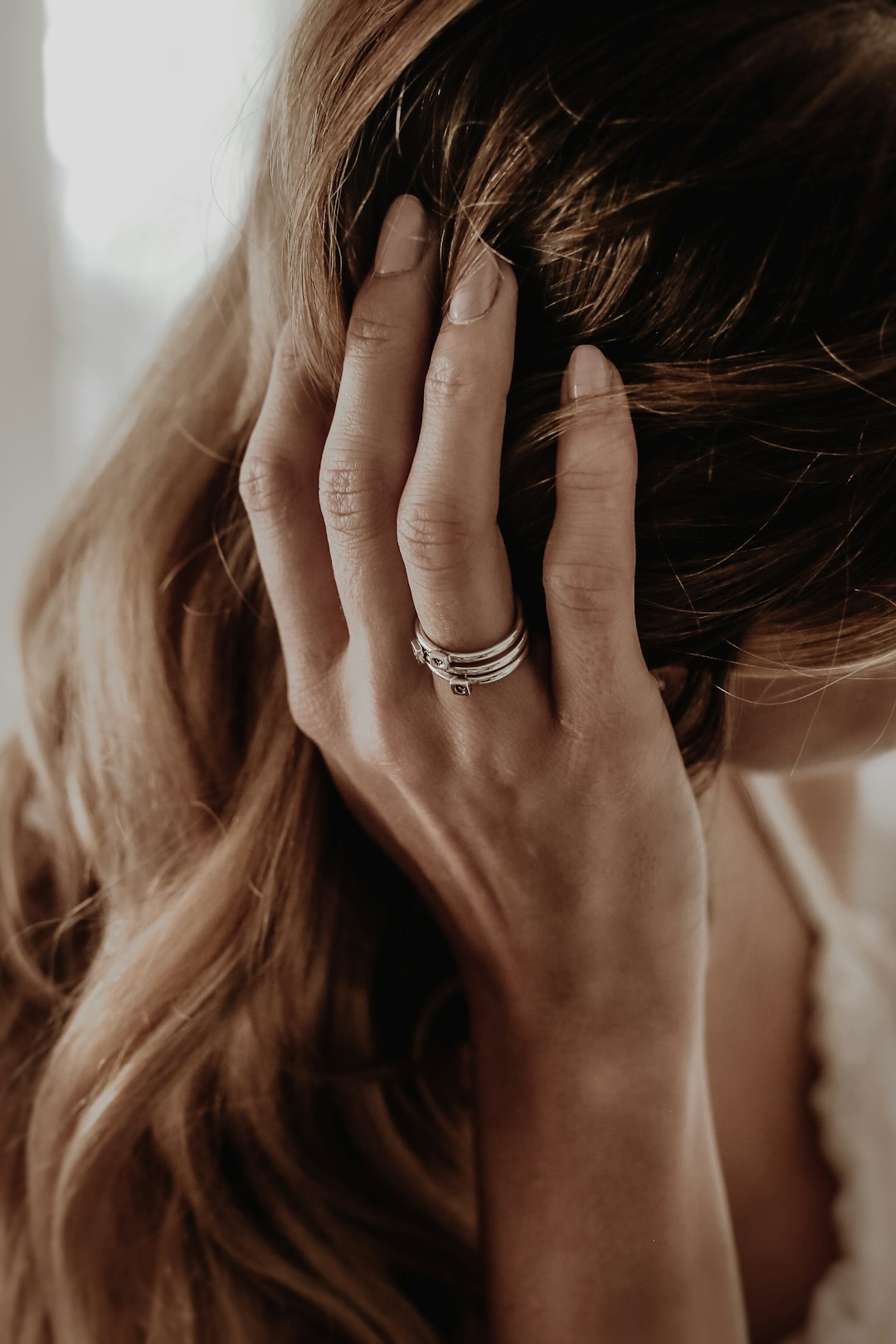 woman wearing gold-colored ring