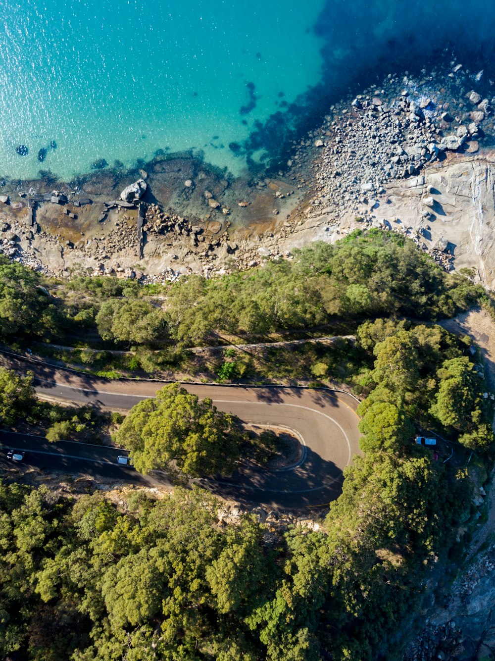 aerial photography of roadway beside sea