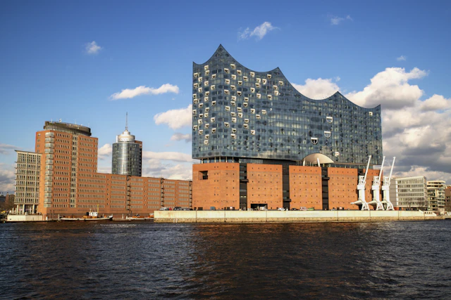 Hamburg's Elbphilharmonie above its red-brick waterfront base beside the River Elbe