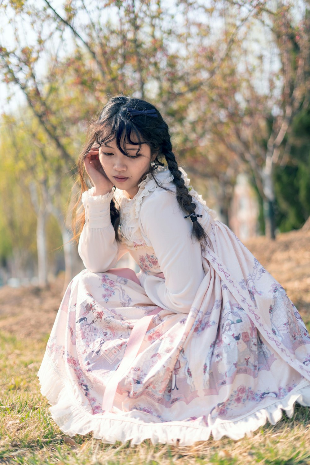 woman in a white and violet ruffled dress