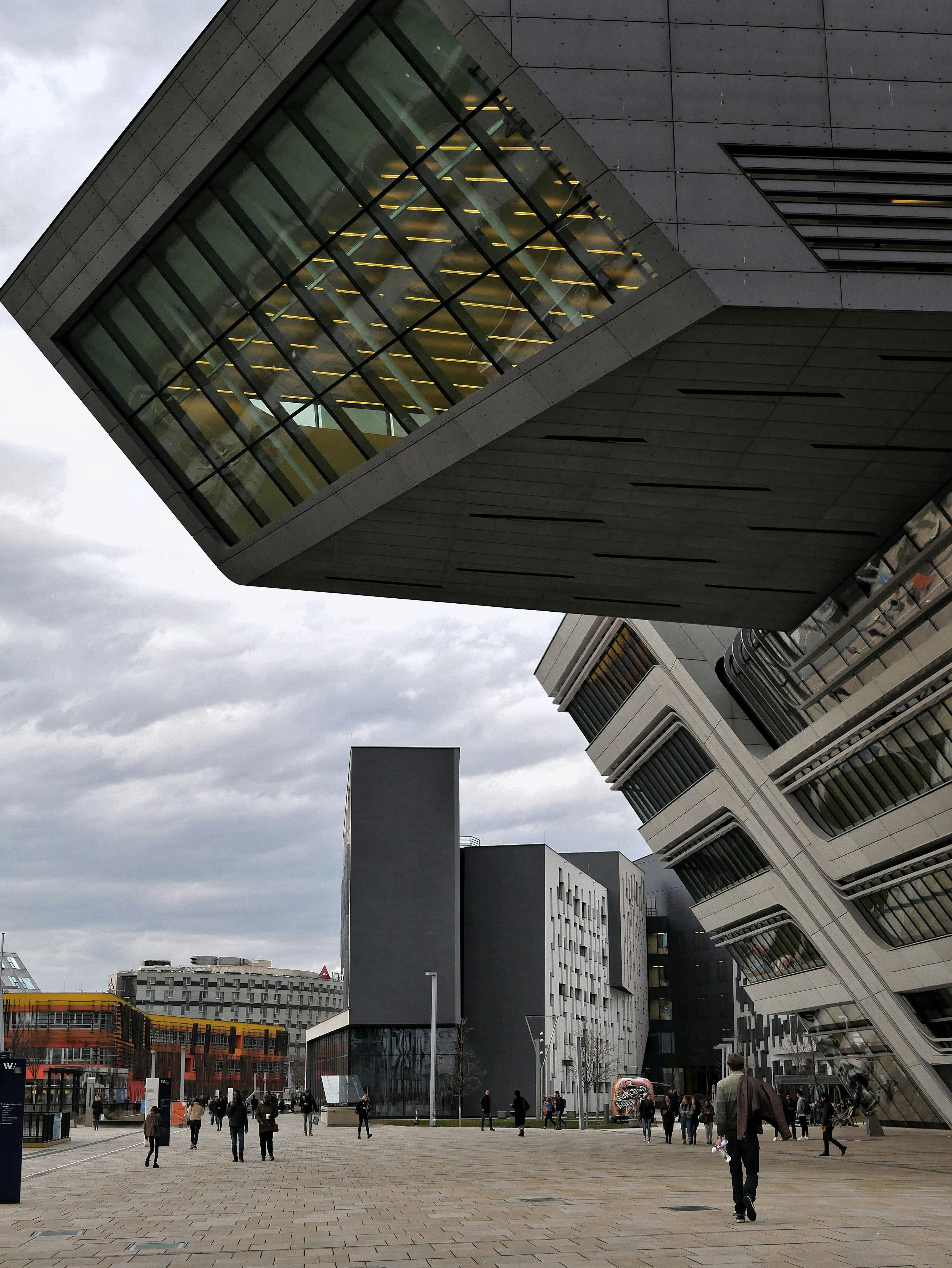 people walking near high rise building at daytime