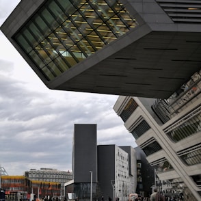 people walking near high rise building at daytime