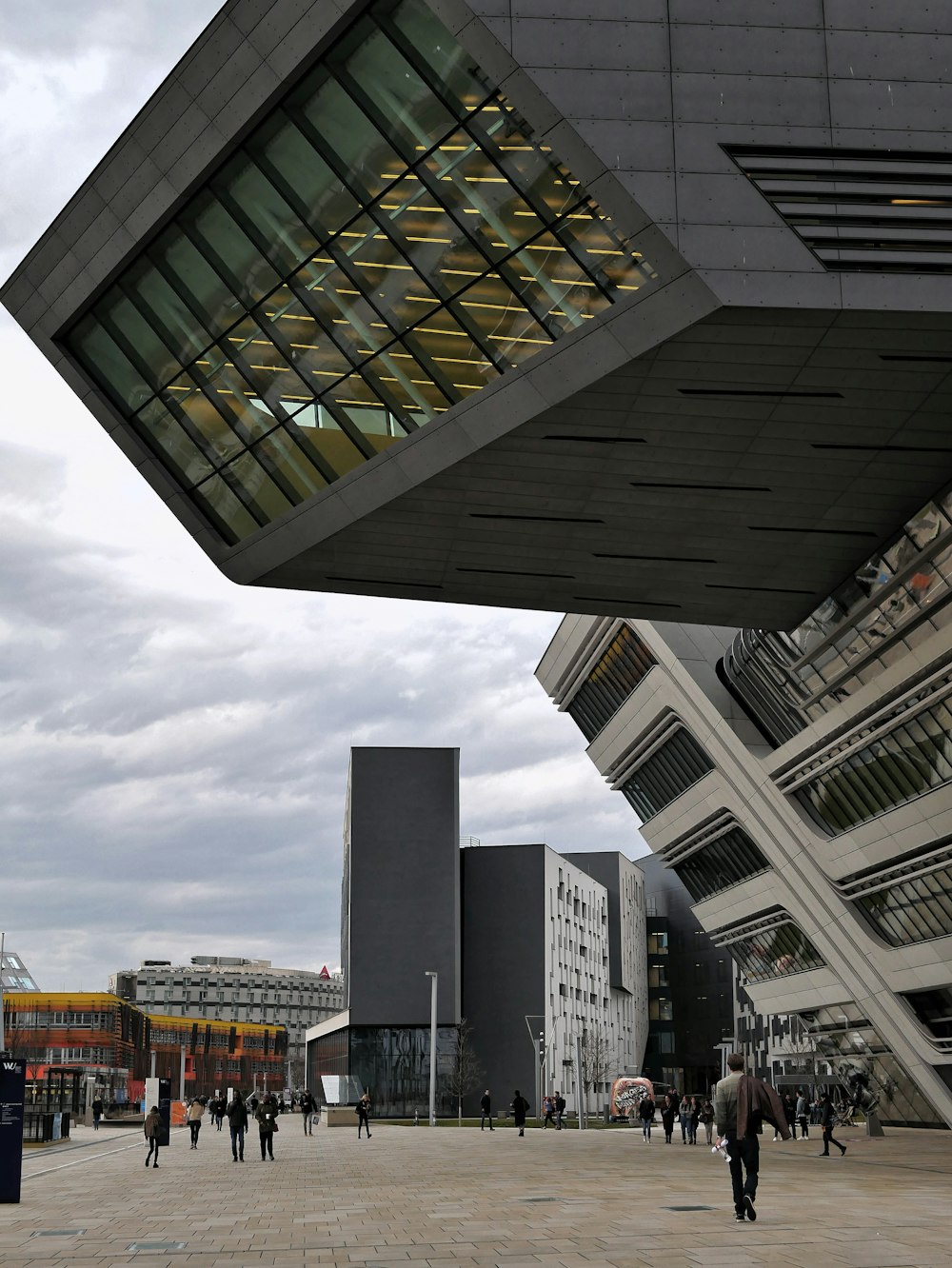 people walking near high rise building at daytime