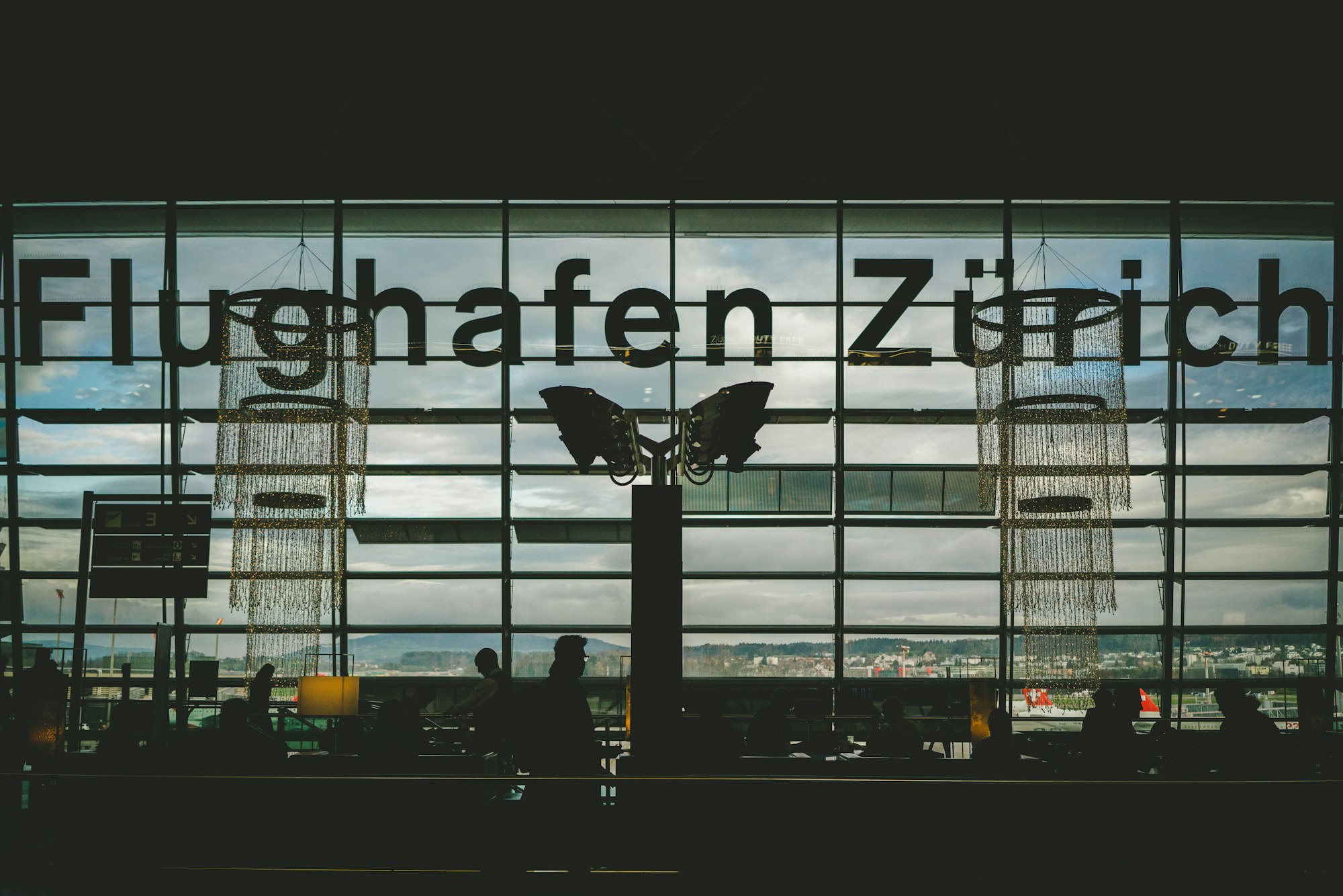 Travellers in the terminal at Zürich Airport, Kloten
