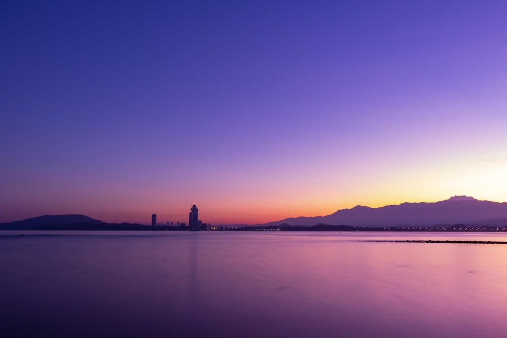 silhouette photo of sea during golden hour