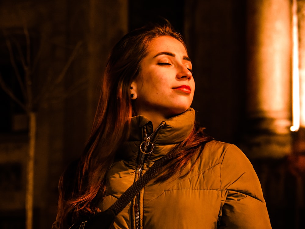 sepia photography of woman wearing bubble jacket