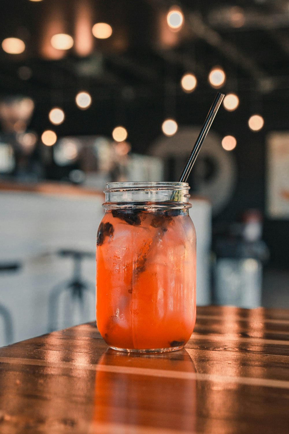 clear glass mason jar with beverage