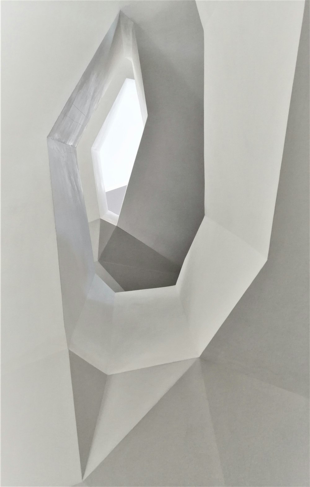 a white sculpture is shown with a white background