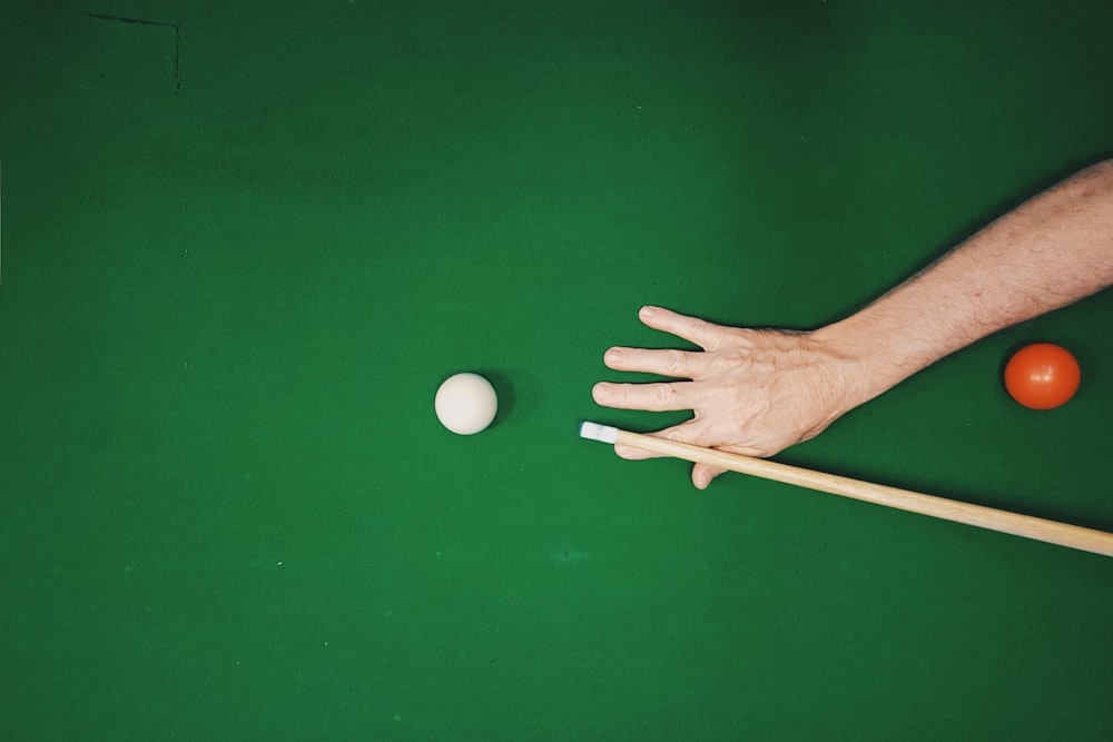 man playing pool