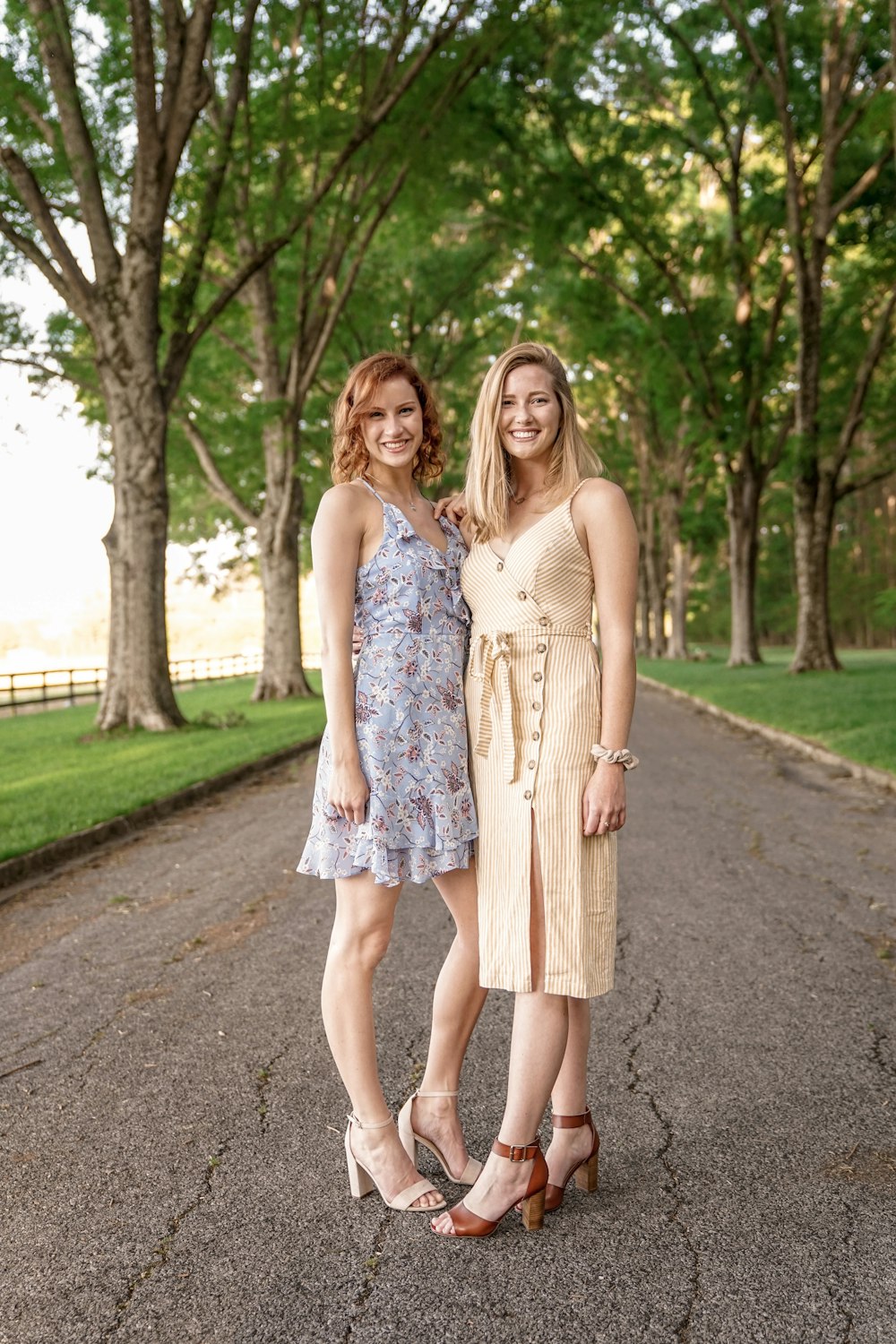 two women standing on street