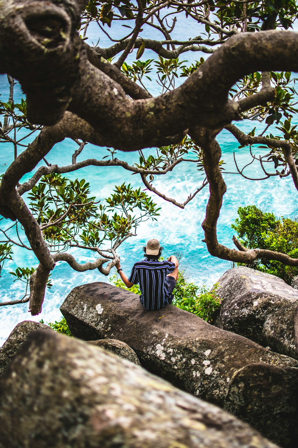 man sitting on rocks