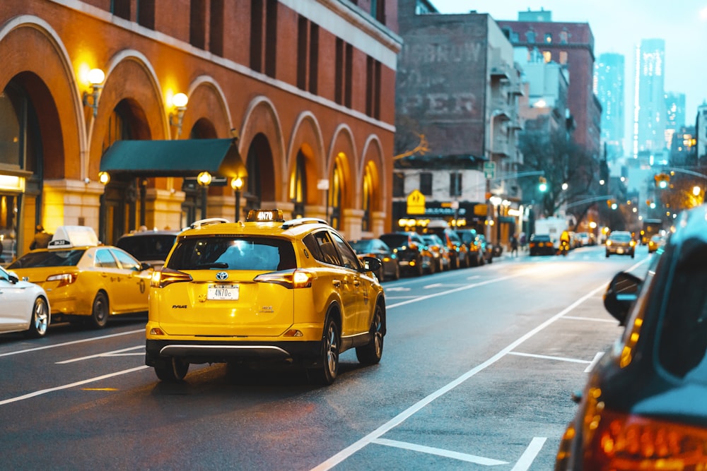 yellow taxi cab on a street