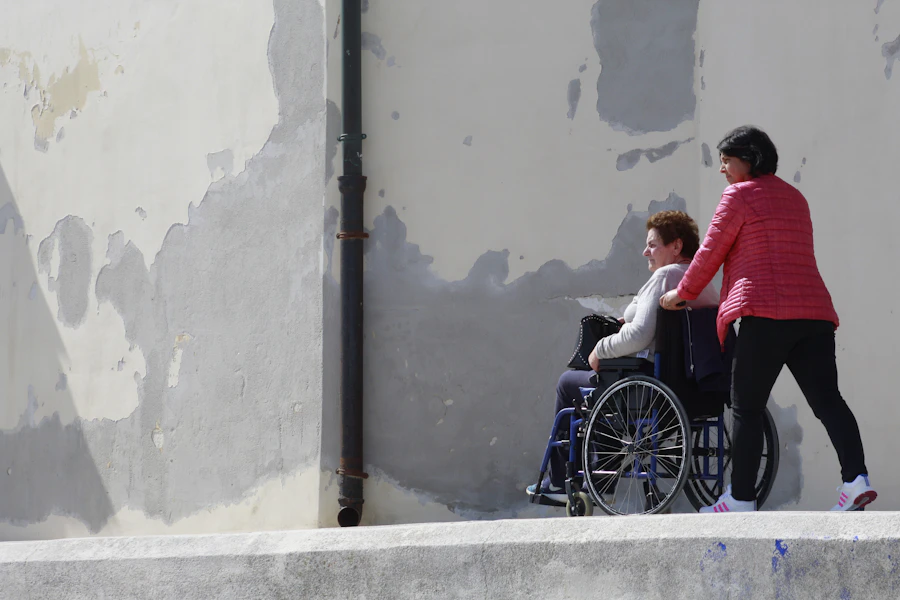 A woman seated in a wheelchair outdoors
