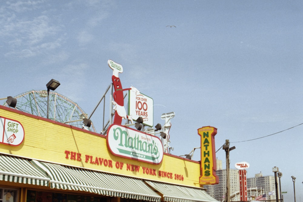 a restaurant with a ferris wheel in the background