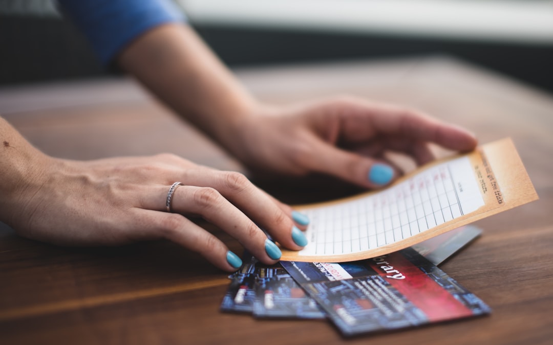 person reading card on three tickets