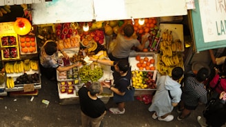 low angle photography of people on market during daytime