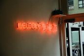 A warm welcome sign at a restaurant entrance.