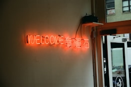 A warm welcome sign at a restaurant entrance.