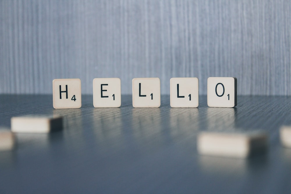 the word hello spelled out with cubes on a table