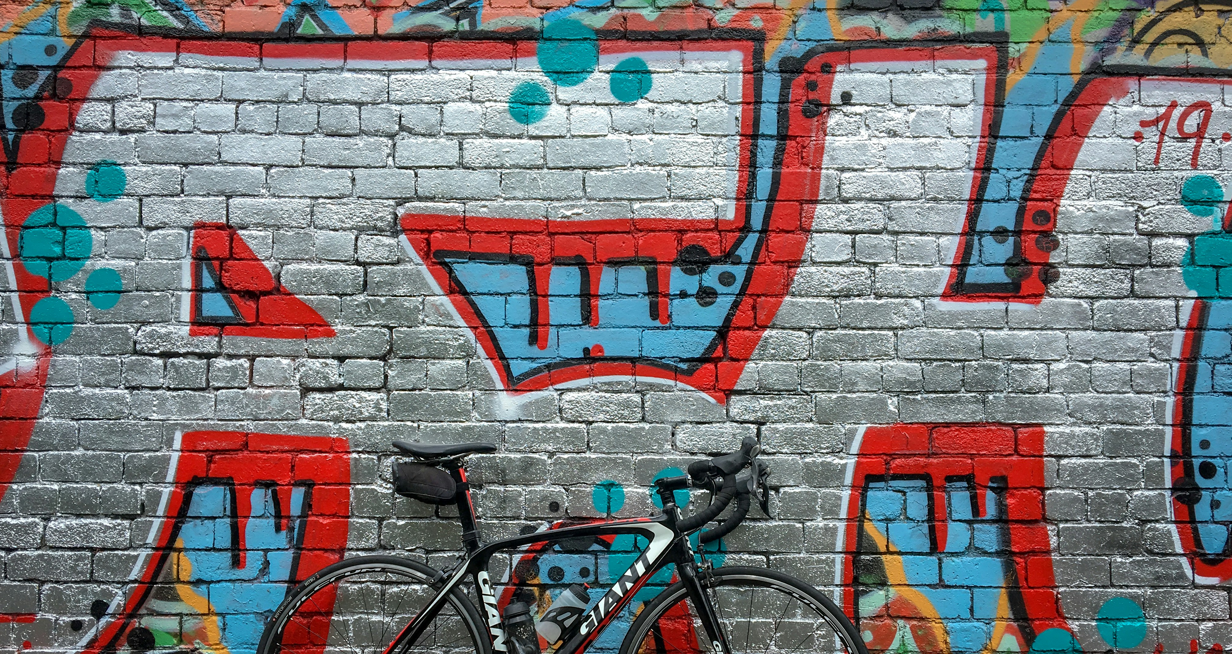 black road bike near wall
