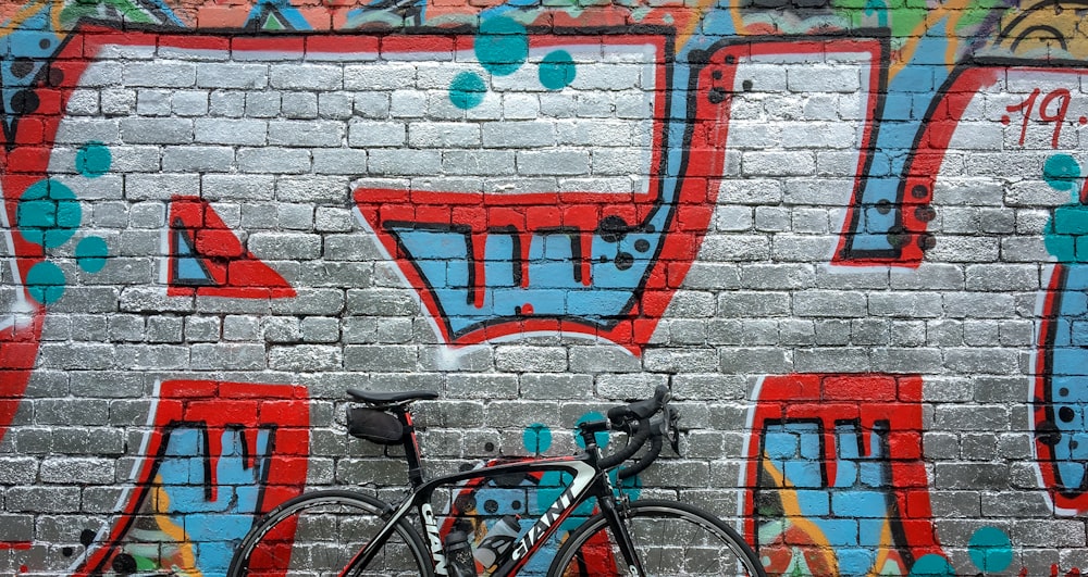 black road bike near wall