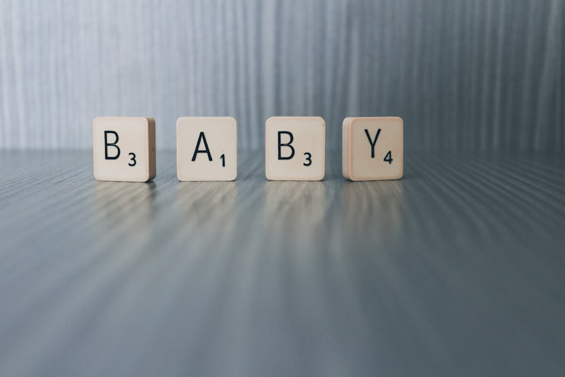 Baby blocks on a wooden surface representing early childhood