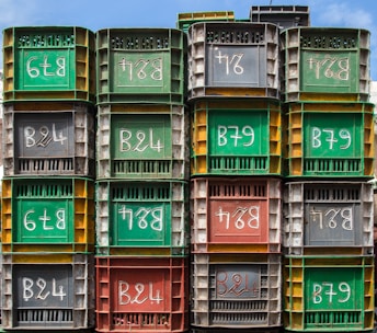 A photo of sturdy bins stacked neatly, ready for delivery.