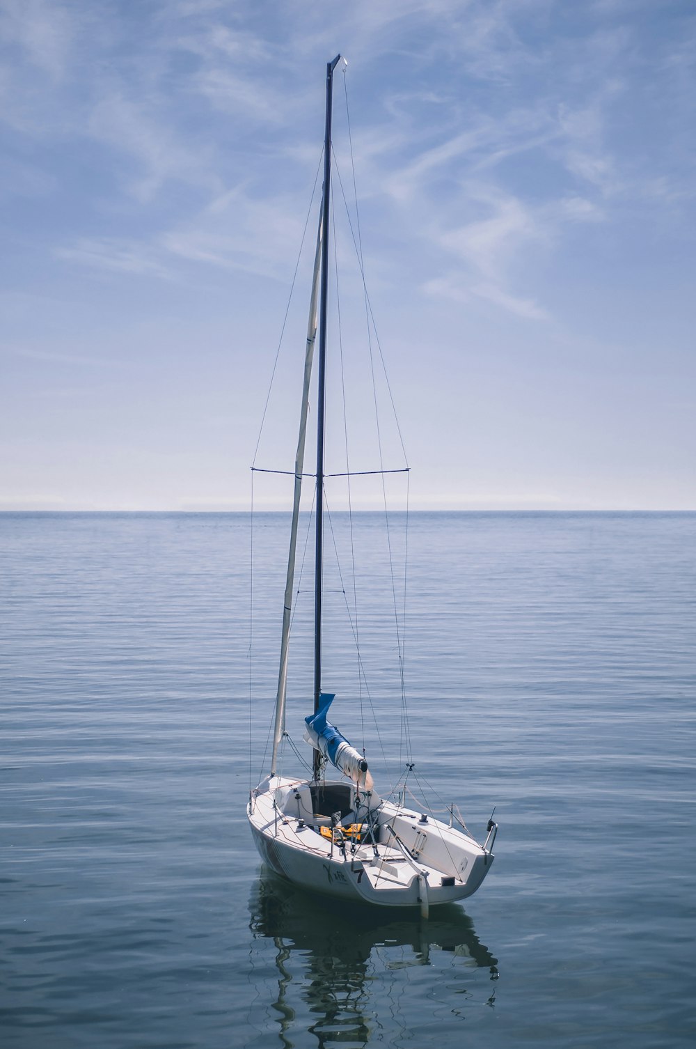 white boat on body of water