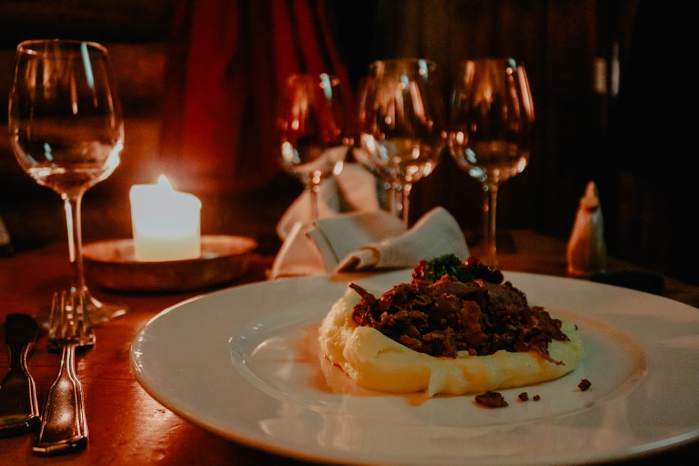 food in plate during candle dinner