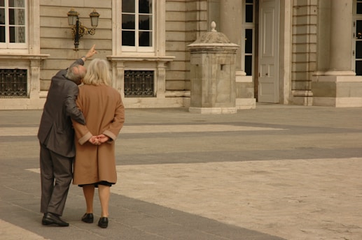 Elegant couple enjoying a private guided tour in a historic city