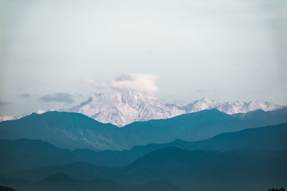 grey mountain under white sky