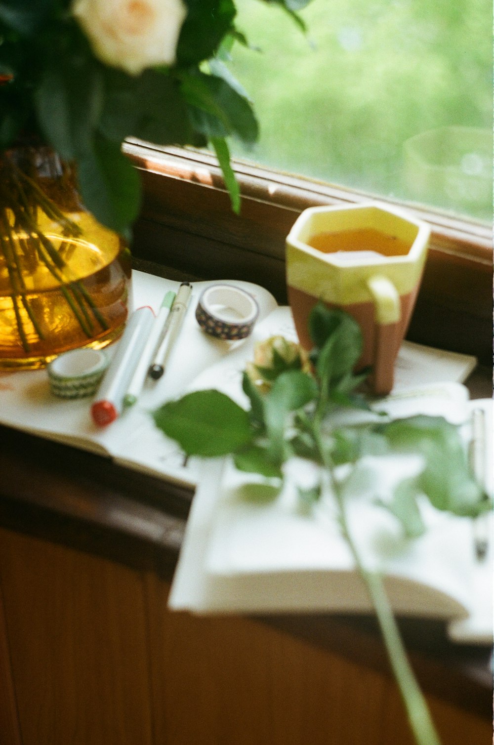 mug near opened book