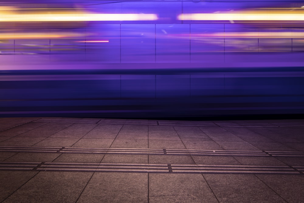 a blurry photo of a train passing by