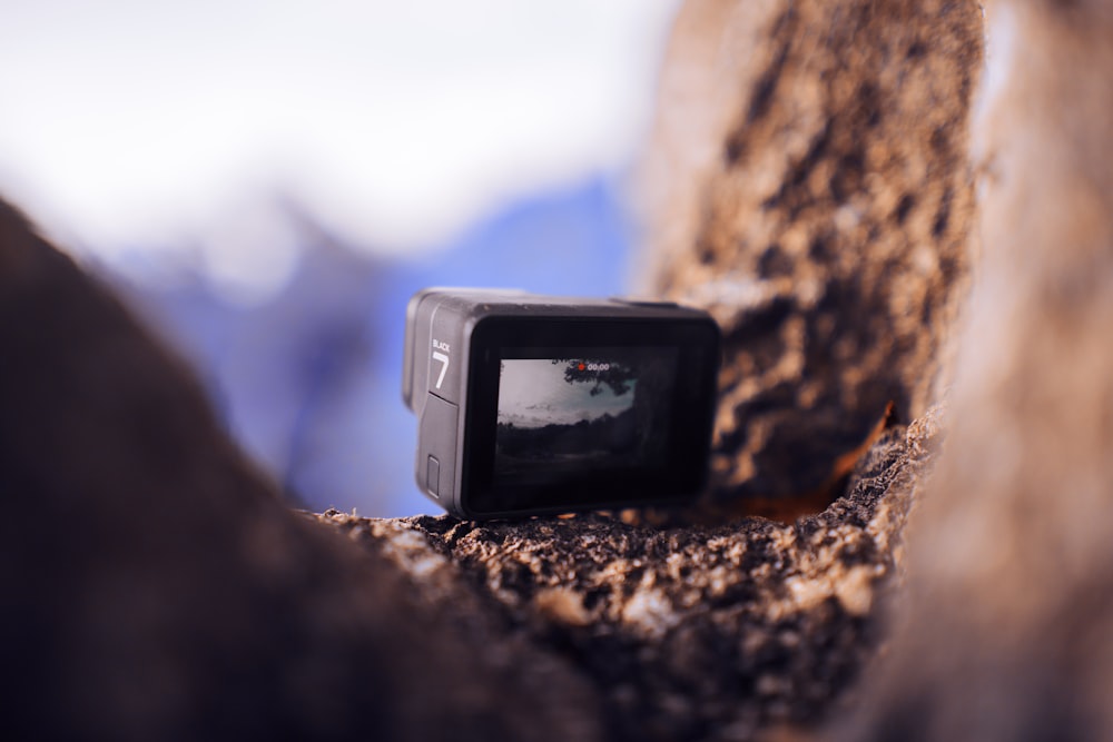 black action camera on focus photography