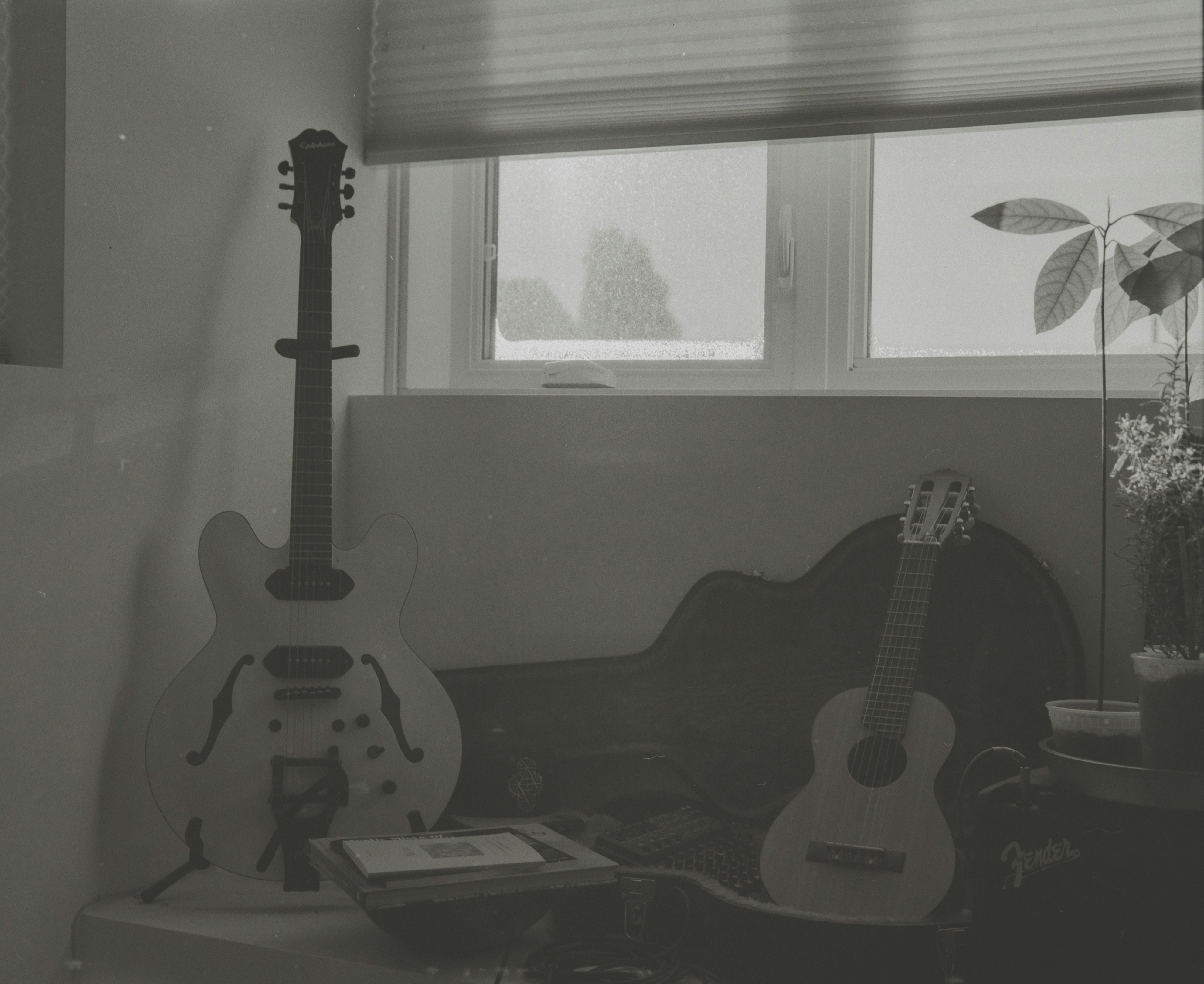 Two guitars wait in a living room, as their players wonder, ‘What is hopecore music?’ exploring the hopecore genre full of positive songs