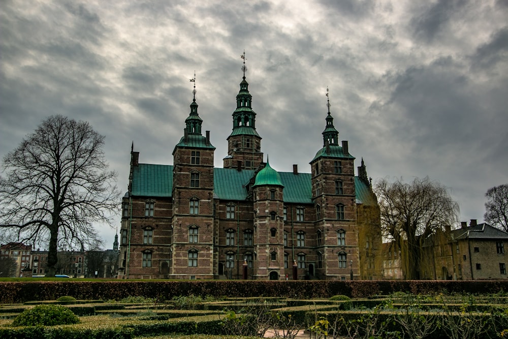 brown concrete museum under cloudy sky