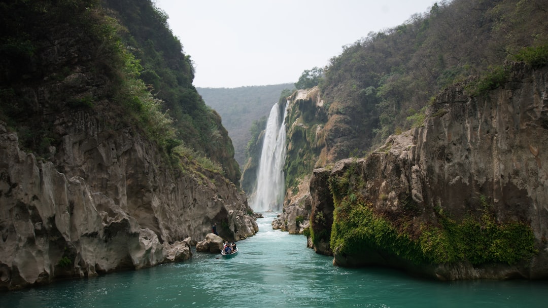 waterfalls on green mountain