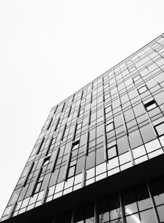 A high-rise building with a sleek facade and panoramic city views.