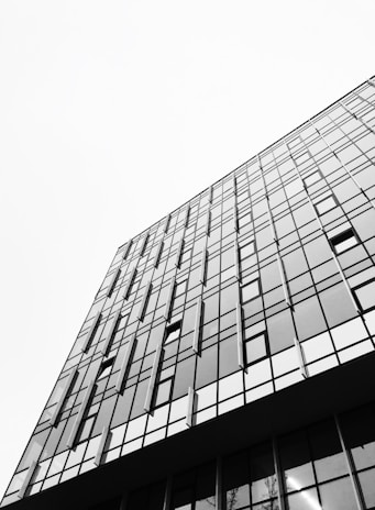 A high-rise building with a sleek facade and panoramic city views.