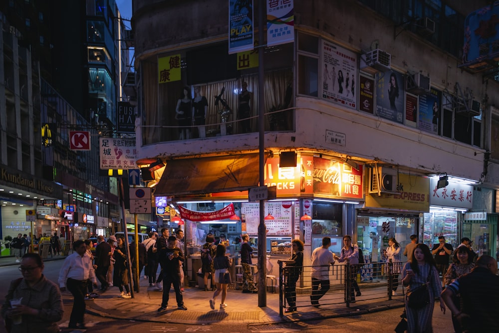 people walking on street during nighttime