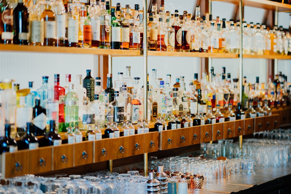 assorted liquor bottles in rack