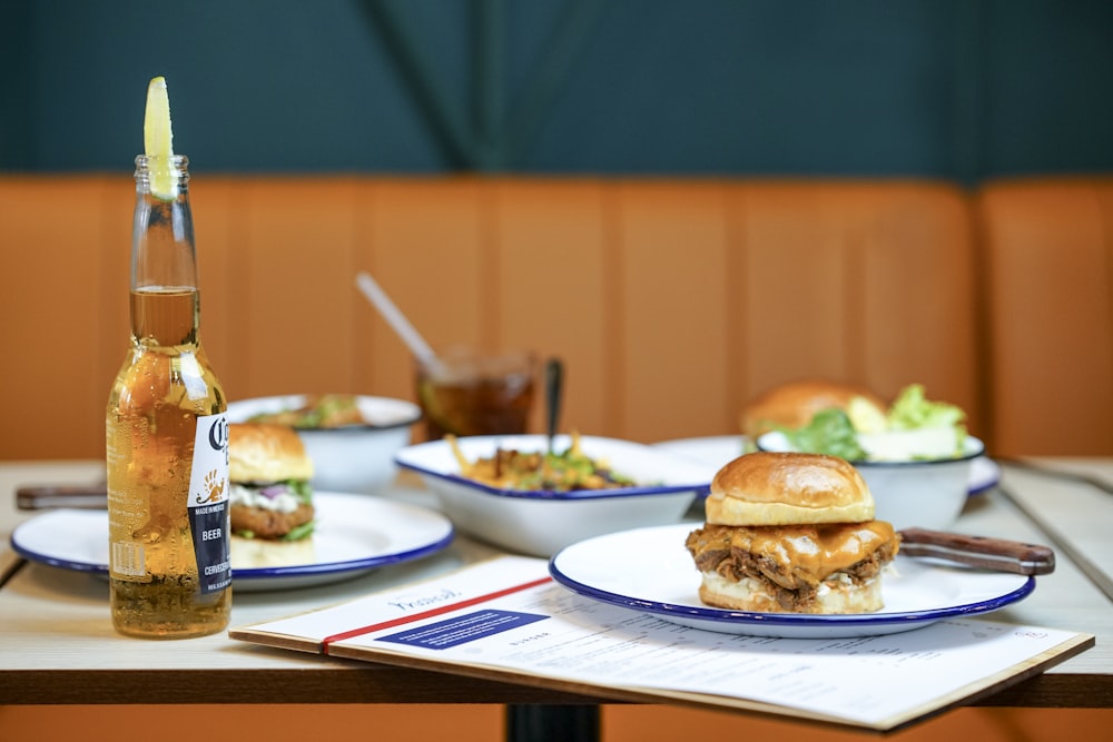 hamburger on plate and Corona bottle