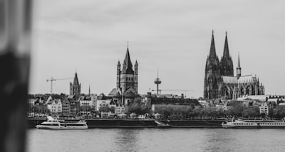 grayscale photography of buildings tower google meet background