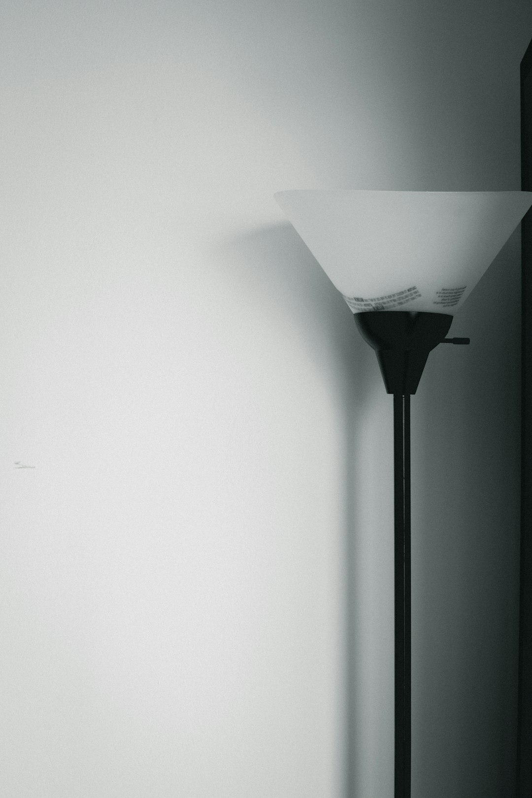 turned-off black and white torchiere lamp